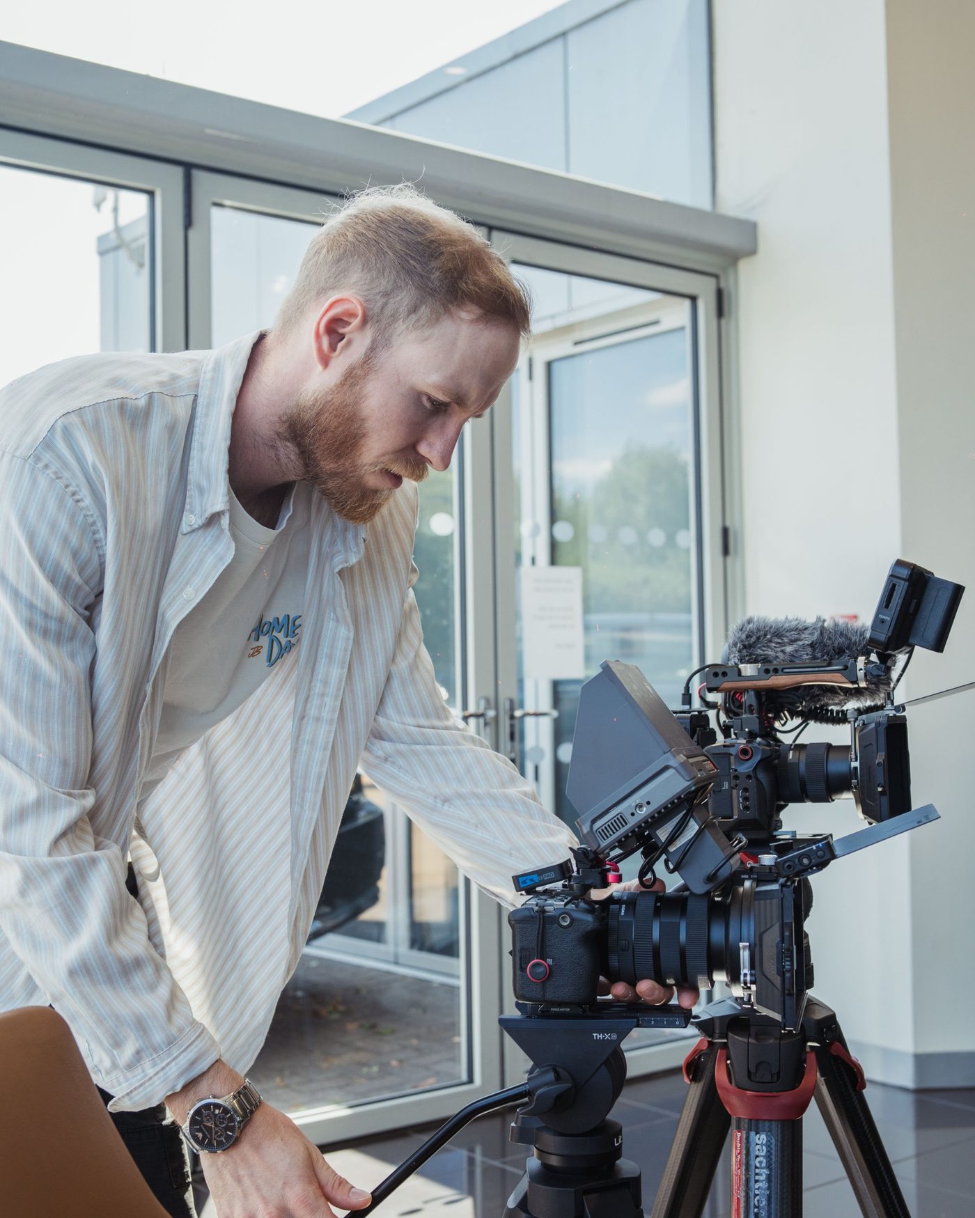 Keegan Starkey setting up a cinema camera on location